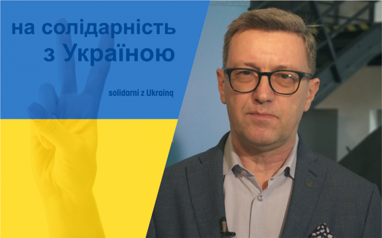 rektor UWM na tle flagi Ukrainy